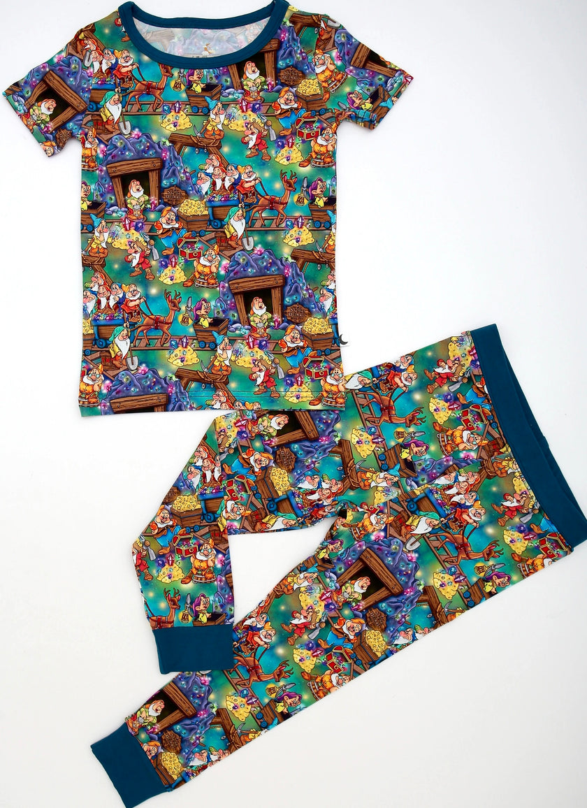Children's pajama set with miners pattern on a white background